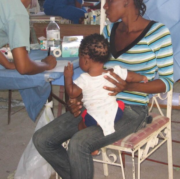 Mother with Child in Clinic Post-Earthquake Haiti